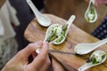 Asparagus canapes on white spoons