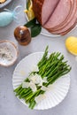 Asparagus cooked on a plate topped with parmesan