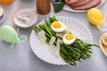 Asparagus cooked on a plate topped with parmesan