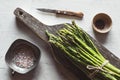 Asparagus on a cut board on an old white background Royalty Free Stock Photo