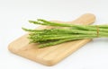 Asparagus and Cutting board isolated on white Royalty Free Stock Photo