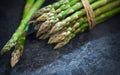 Asparagus. Fresh raw organic green Asparagus sprouts closeup. Basket and bunch n the table. Healthy vegetarian food Royalty Free Stock Photo