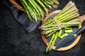 Asparagus. Fresh raw organic green Asparagus sprouts closeup. On black table background. Healthy vegetarian food Royalty Free Stock Photo