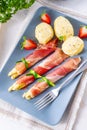 Asparagus ham rolls with strawberries and hollandaise Royalty Free Stock Photo
