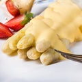 Asparagus , hollandaise sauce and baked potatoes