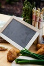 Asparagus, potatoes, empty blackboard Royalty Free Stock Photo