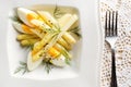 Asparagus salad with egg and fresh dill on a plate
