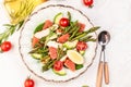 Asparagus salad grapefruit, cherry tomatoes, avocado, chicken fillet, spinach in bowl. ketogenic diet, diet lunch concept. Keto