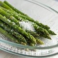 Asparagus with Salt on Glass Dish Royalty Free Stock Photo