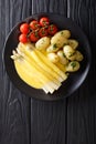 Asparagus served with hollandaise sauce, new potatoes and tomato Royalty Free Stock Photo