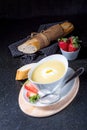 Asparagus soup with poached egg and fresh baguettes