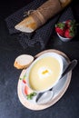 Asparagus soup with poached egg and fresh baguettes