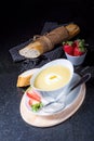 Asparagus soup with poached egg and fresh baguettes