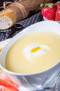 Asparagus soup with poached egg and fresh baguettes