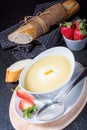 Asparagus soup with poached egg and fresh baguettes