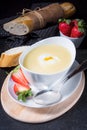 Asparagus soup with poached egg and fresh baguettes