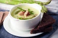 Asparagus soup in white bowl Royalty Free Stock Photo