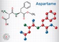 Aspartame, APM, molecule. Sugar substitute and E951. Sheet of paper in a cage. Structural chemical formula and molecule model