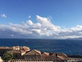 Aspect of tiled roofs at the old citadel town of Monemvassia, Greece, with the blue sea in the background