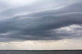 Asperatus-undulatus dark clouds over the lake Royalty Free Stock Photo