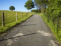 Asphalt agricultural road uphill blue sky