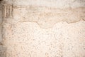 Asphalt close-up, wet concrete wall texture. Raw plaster wall background. Royalty Free Stock Photo
