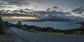 Asphalt coastal road with ocean during sunset Royalty Free Stock Photo