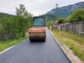 Asphalt compactor roller in Salciua village Royalty Free Stock Photo