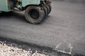 Asphalt Compactors is carrying out road repair work. Laying new asphalt. Large heavy machinery. Construction of a new