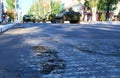 Asphalt damage during military parade in the city, ordered military equipment, tanks, guns and other weapons in the street for