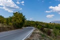 Empty asphalt road on mountain and beautiful sky with white clouds Royalty Free Stock Photo