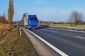 Asphalt highway and blue truck Royalty Free Stock Photo