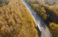 Asphalt highway or motorway autumn road in countryside with car and truck traffic Cargo Semi Trailer Moving. Aerial Top View Royalty Free Stock Photo