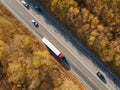 Asphalt highway or motorway road in countryside with car and truck traffic Cargo Semi Trailer Moving. Aerial Top View Royalty Free Stock Photo