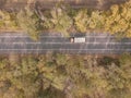 Asphalt highway or motorway road in countryside and truck traffic Cargo Semi Trailer Moving. Aerial Top View Royalty Free Stock Photo