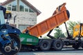 Asphalt higway road construction site. Heavy industrial machinery at roadworks and blue sky backround. Steam roadroller , paver Royalty Free Stock Photo