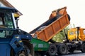 Asphalt higway road construction site. Heavy industrial machinery at roadworks and blue sky backround. Steam roadroller , paver Royalty Free Stock Photo