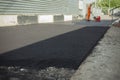 Asphalt laying. Road surface repair. Royalty Free Stock Photo