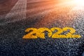 2022 tyre trail on asphalt calendar on asphalt motivational writing as a metaphor for moving forward