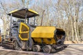 Asphalt paver on construction site ready for work Royalty Free Stock Photo