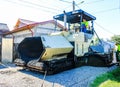 Asphalt paver machine. Construction machines and equipment new for new road with support from the European Union structural funds