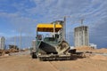 Asphalt paver machine during road work. Road Machinery at construction site for paving works