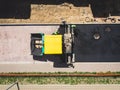 Asphalt paver machine and steam road roller during road construction and repairing works, process of asphalting and paving,