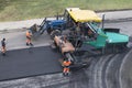 Asphalt paver machine, tractor on the road repair site