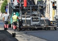 Asphalt paving machinery at work