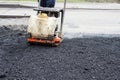 Asphalt rammer. laying the road surface