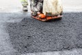 Asphalt rammer. laying the road surface