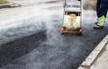 Asphalt rammer. laying the road surface