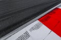 Asphalt red and white kerb of a race track detail with tire marks Royalty Free Stock Photo