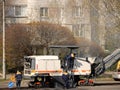 Asphalt removal using heavy machinery. Construction and repair of the road. Modern technology of laying a highway with a solid